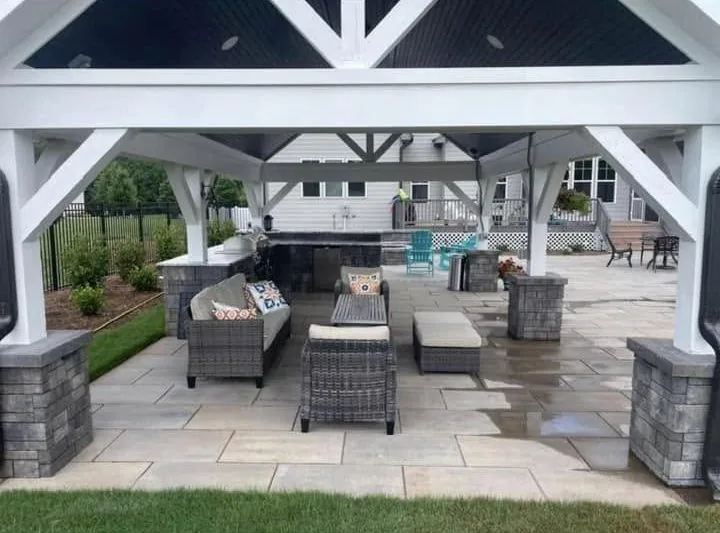 Covered outdoor patio pavilion over stone pavers