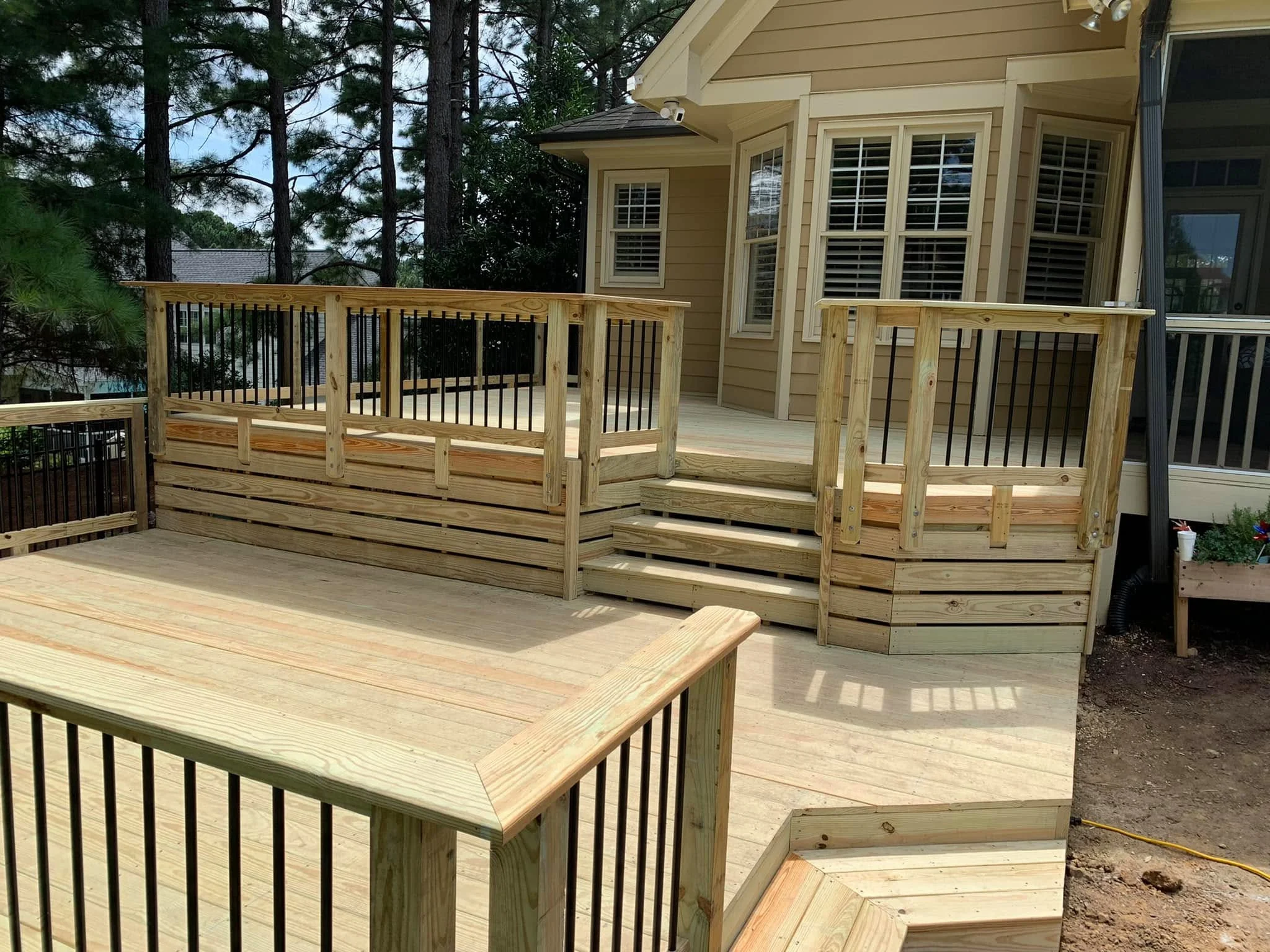 Custom wood deck with wraparound steps